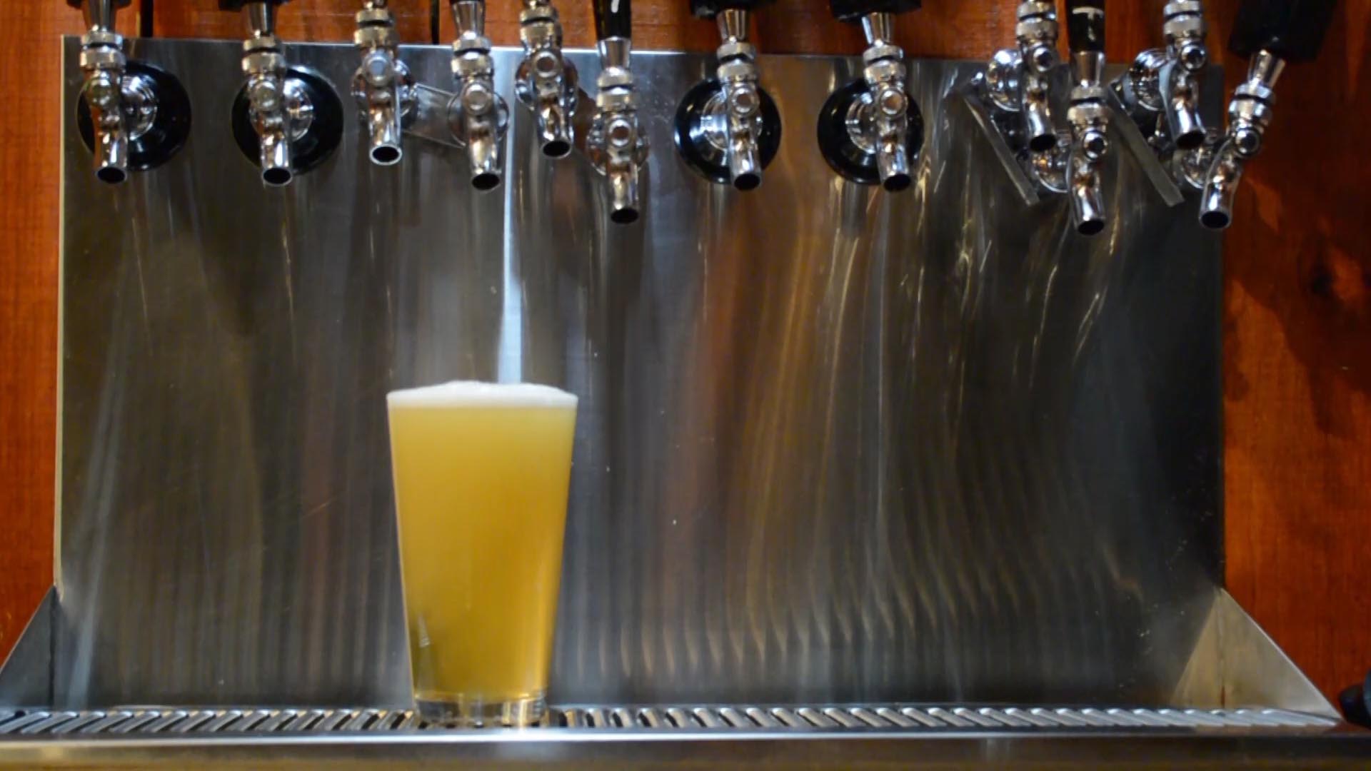 Pouring a Beer From A Tap