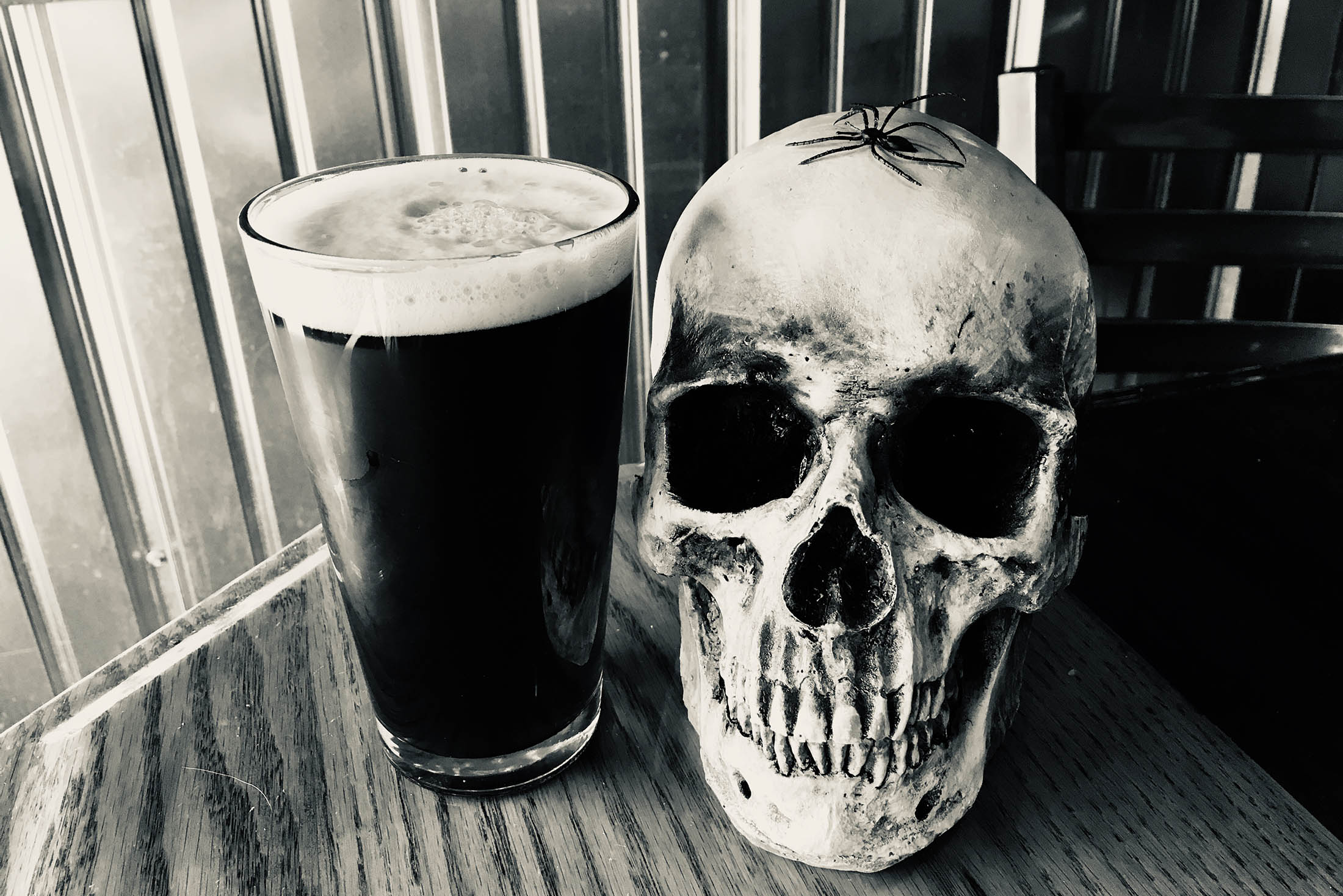 Hops and Haunts - Pint of beer with a skull